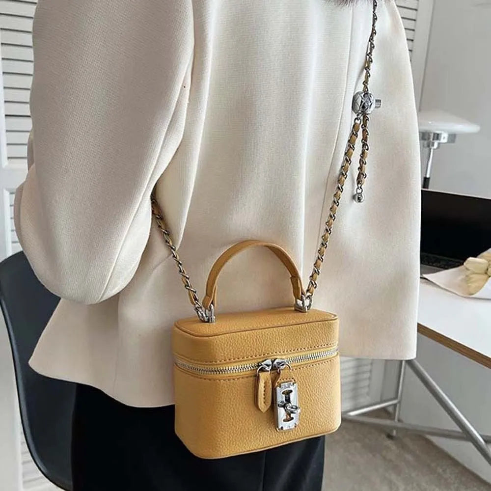 Bolso de mano cuadrado compacto con textura granulada, cierre de cremallera, estilo macaron, de cuero vegano, construcción sólida.