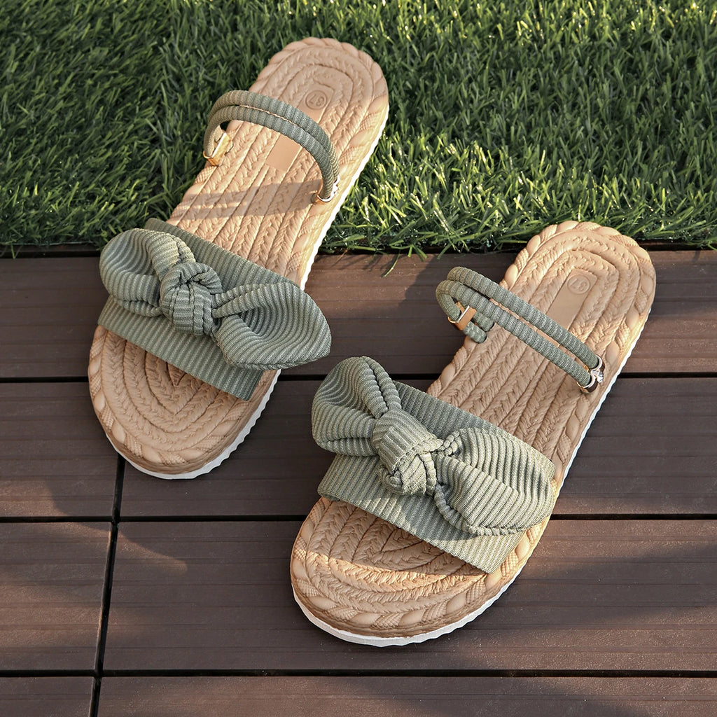 Sandalias planas con lazo de pana a la moda, zapatillas ligeras antideslizantes para exteriores para mujer, sandalias de playa informales de suela blanda para verano 2025