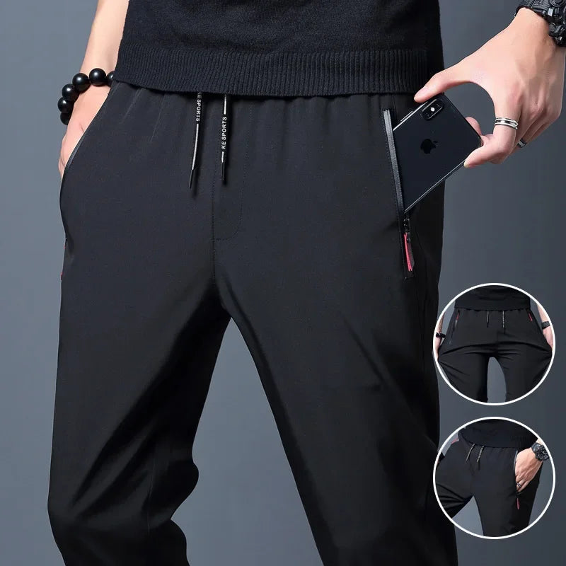 Pantalones informales para hombre, pantalones elásticos ajustados con cintura elástica, pantalones clásicos coreanos azules, negros y grises de marca para hombre de talla grande