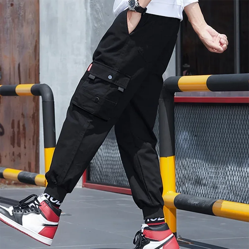 Nuevos pantalones de trabajo de calle para primavera y otoño para hombre, moda informal coreana Ins, pantalones deportivos de Hip-hop sueltos de nueve minutos, pantalones con cordón
