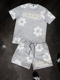 Conjunto de camiseta y pantalones cortos con estampado gráfico de flores en blanco y negro para hombre, conjunto de 2 piezas con cuello redondo, Top de manga corta, pantalones cortos con cintura elástica