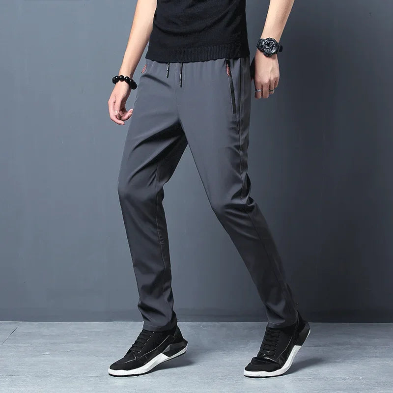Pantalones informales para hombre, pantalones elásticos ajustados con cintura elástica, pantalones clásicos coreanos azules, negros y grises de marca para hombre de talla grande