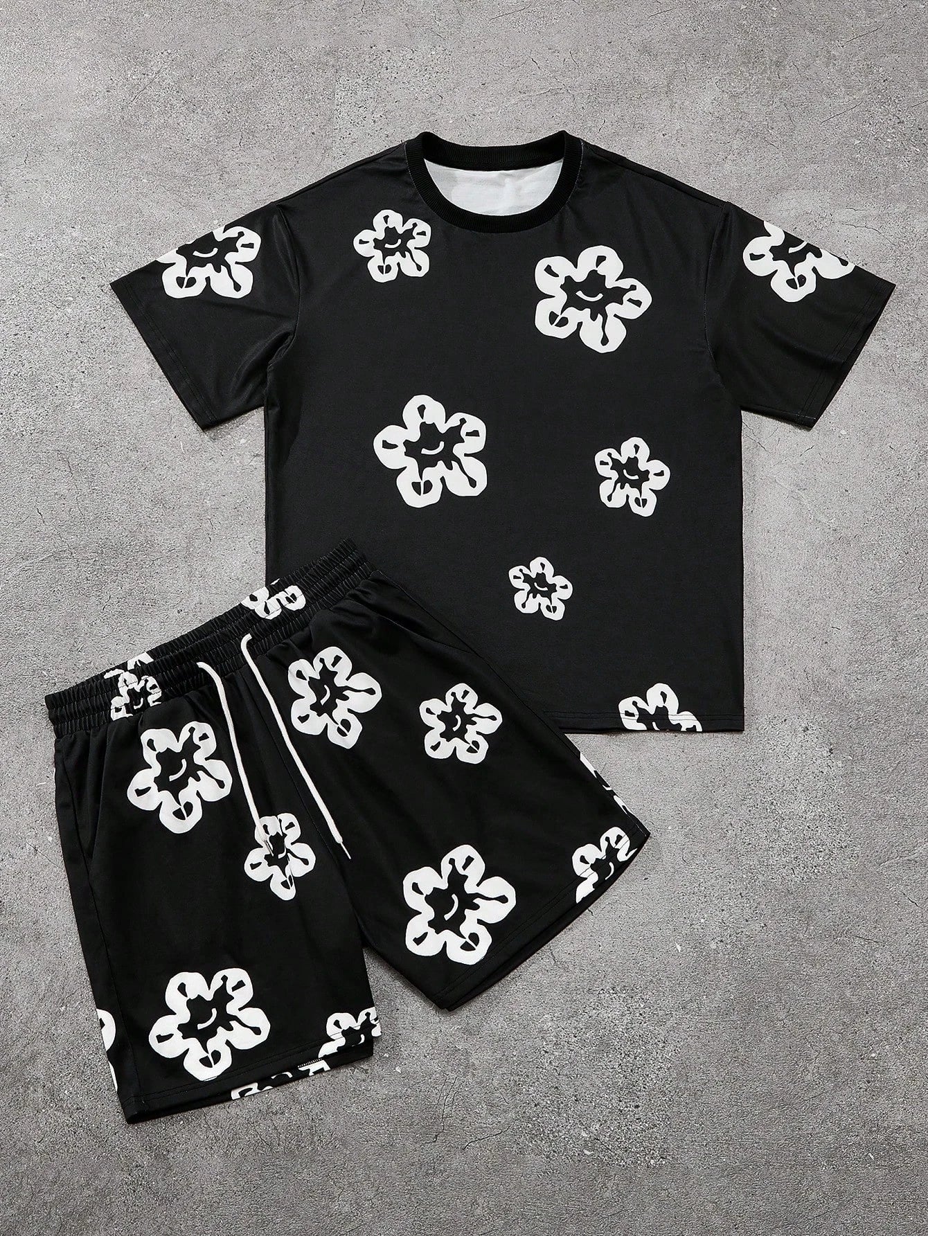 Conjunto de camiseta y pantalones cortos con estampado gráfico de flores en blanco y negro para hombre, conjunto de 2 piezas con cuello redondo, Top de manga corta, pantalones cortos con cintura elástica